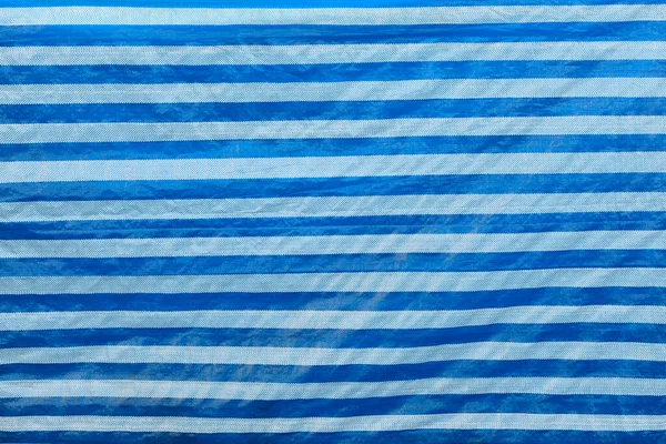 Niebieski Arkusz Niebieska Plastikowa Ściana Ogrodzenia Zbliżenie Tle — Zdjęcie stockowe