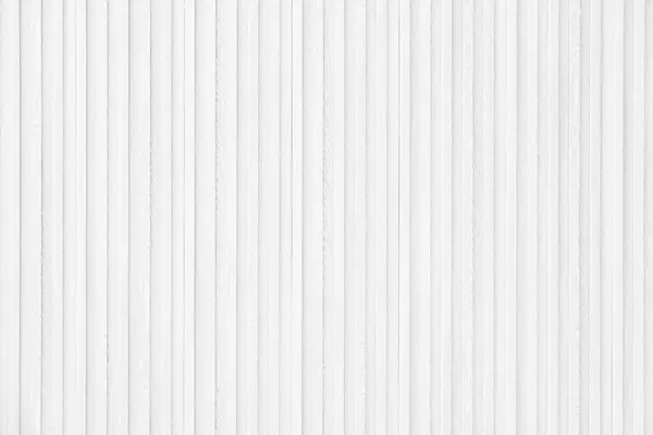 White interior wooden wall cladding made from strips of plywood, wood wall texture background