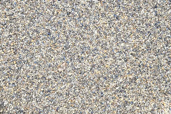 Renkli dekoratif çakıl arka planı. Bahçe havuzu arka planı. Doğal kum dokusu. Üst görünümü kapat.
