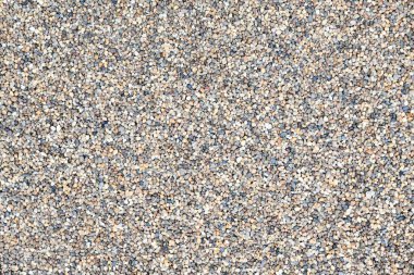 Dekoratif çakıl zemin zemin. Bahçe havuzu arka planı. Doğal kum dokusu. Üst görünümü kapat.