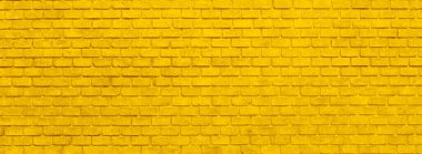 Arkaplan için uzun, geniş bir altın tuğla duvar fotoğrafı