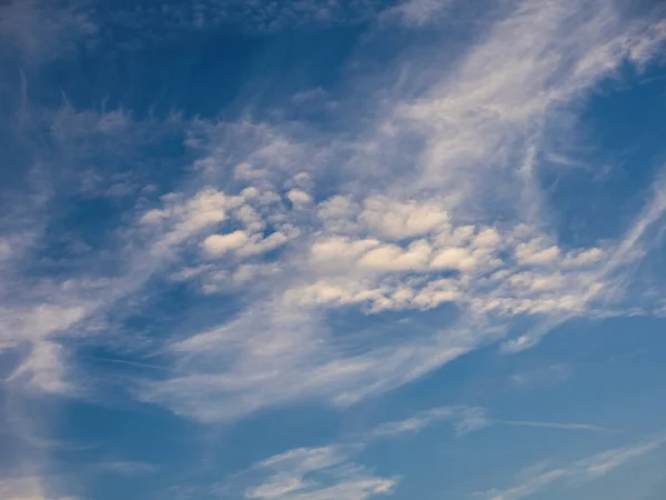 stock image Blue sky with unusual abstract white clouds. Strange dramatic clouds pattern texture.