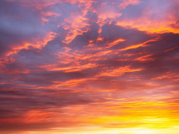 Dramatic dusk sky with clouds. Mysterious abstract heaven background pattern texture at sunset.  