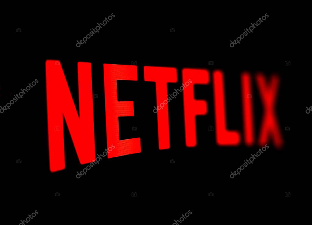 Kyiv, Ukraine -  March 9, 2021: Netflix logo on the screen. Netflix is an American content platform and production company offering online streaming service from a library of films and TV series.