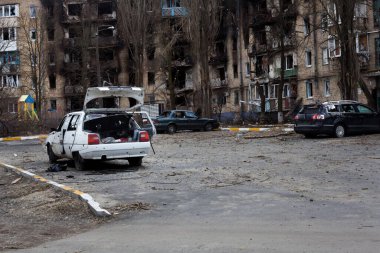 Irpin, Kyiv region, Ukraine -  April 12, 2022: Russian invasion of Ukraine. Residential buildings and cars damaged by Russian bombardments. Traces of shelling and fire. Destructed apartments.