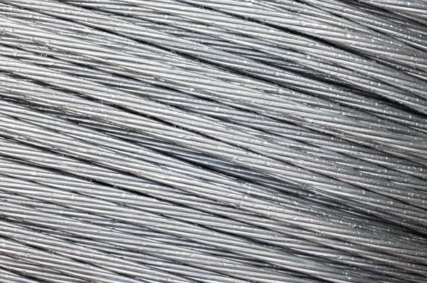 Electric galvanized steel wire on the big reel. Cable reel. Electrical wire. Close-up.