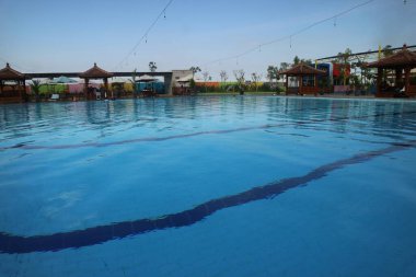 Swimming pool with blue sky background