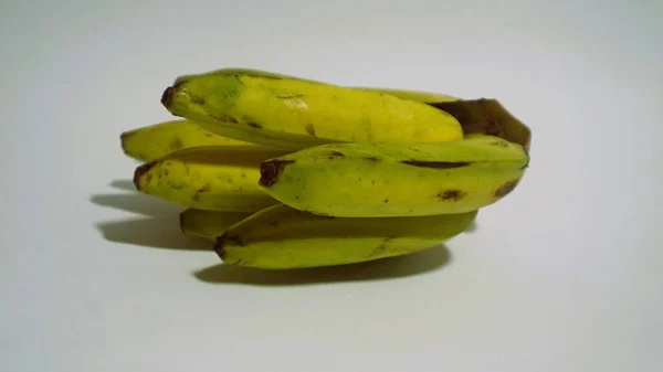 Banana isolated white, a popular fruit that is easy to eat by removing its thick skin, Musa paradisiaca, contains vitamins A, C, and B6 to boost the body immunity.