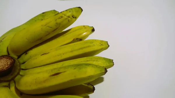 Banana isolated white, a popular fruit that is easy to eat by removing its thick skin, Musa paradisiaca, contains vitamins A, C, and B6 to boost the body immunity.