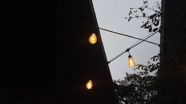 Вінтажні Лампочки Струнному Дроті Проти Заходу Сонця — стокове фото