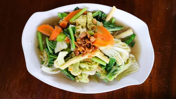 Cap cay or cap cai is a popular stir fried dish that originates from Chinese cuisine. this dish contains many vitamins and minerals as it is made mainly of vegetables. served on bowl. selected focus