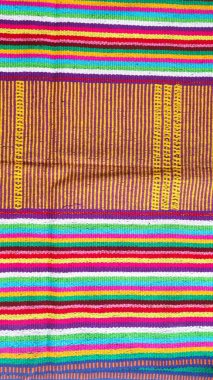 Endonezya 'dan eşsiz desenli el yapımı, desenli çok renkli etnik kumaş arka planı.