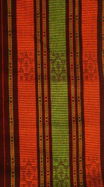 Endonezya 'dan eşsiz desenli el yapımı, desenli çok renkli etnik kumaş arka planı.