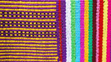 Endonezya 'dan eşsiz desenli el yapımı, desenli çok renkli etnik kumaş arka planı.