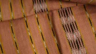 Dönen desenli çok renkli etnik kumaş arka plan, el yapımı, Endonezya 'dan eşsiz desenli tekstil., 