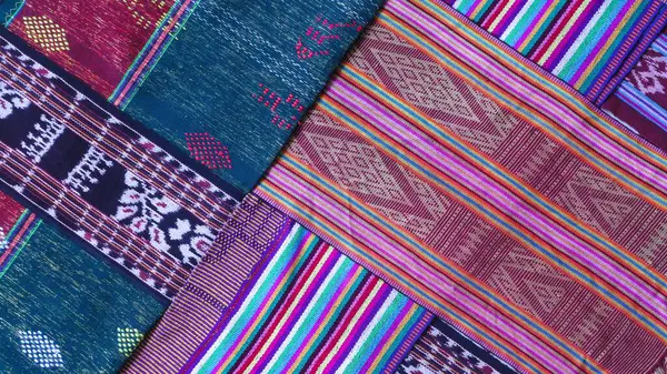 Various pattern handmade woven fabric from Indonesia, multicolor geometric textured textile background