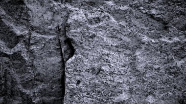 Gri taneli grunge pankartı. Soyut kaba taş arka plan. Taş duvarın dokusu. Yakın plan. Açık gri kaya arkaplanı.