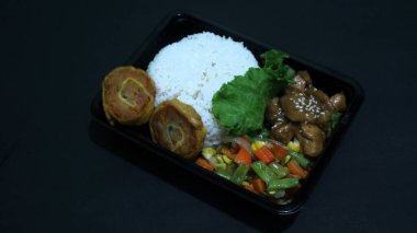 Nasi Bento lunch package consist of rice, chicken rolade and vegetable, Indonesia president Prabowo government  provide free lunches for school children clipart