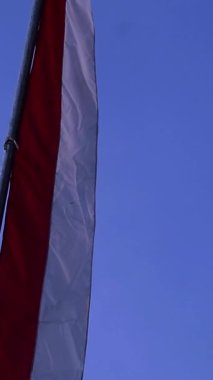 Red and white pennants with blue sky background during Indonesia independence day  celebration, copy space