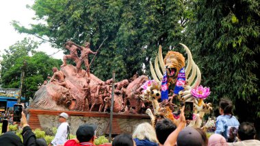 Malang, Indonesia, August 25 2024: Malang Flower Carnival is fashion parade that defines flowers as Identity of Malang City. Combining art elements, culture, tourism and history as a show-off moments for local artist. clipart