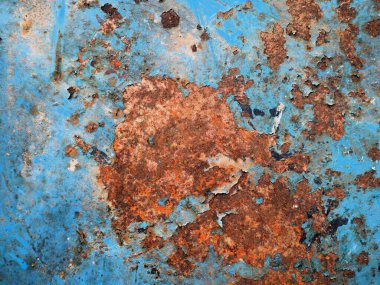 Close-up rusty iron surface, perfect for abstract vintage backgrounds. Metal corrosion is caused by oxygen oxidation, a natural chemical reaction process.  clipart