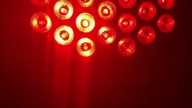 Gleaming, multi-colored lights in green, blue, red, and yellow create a sparkling background perfect for a party, celebration, or victory, 4k footage