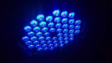 Gleaming, multi-colored lights in green, blue, red, and yellow create a sparkling background perfect for a party, celebration, or victory, 4k footage