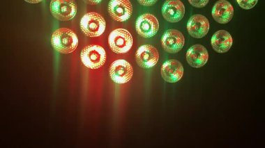 Gleaming, multi-colored lights in green, blue, red, and yellow create a sparkling background perfect for a party, celebration, or victory, 4k footage