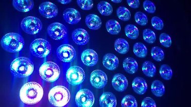 Gleaming, multi-colored lights in green, blue, red, and yellow create a sparkling background perfect for a party, celebration, or victory, 4k footage