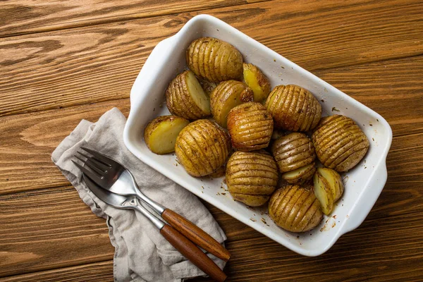 Hasselback Potatoes Herbs White Ceramic Casserole Dish Wooden Rustic Table — Stock Photo, Image