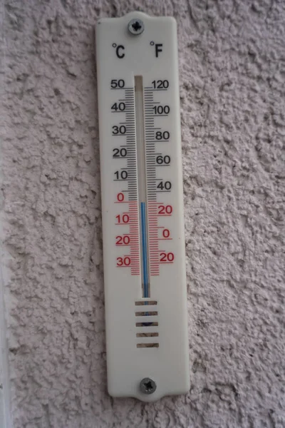 Analog alcohol outside thermometer showing 0 degrees Celsius or 32 Fahrenheit