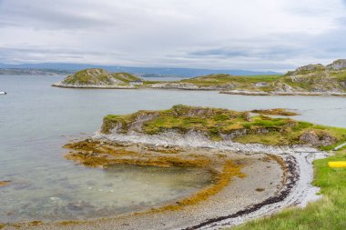 Landscape of Norwegian nature at Trollholmsund dolomite rock formations next to Porsangerfjord in Norway clipart