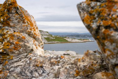 Landscape of Norwegian nature at Trollholmsund dolomite rock formations next to Porsangerfjord in Norway clipart