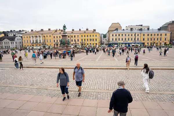 stock image Helsinki, Finland - 07.11.2024: Tourists in Senate Square in Helsinki, Finland