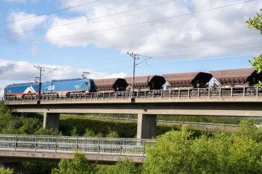 Abisko, Sweden - 07.09.2024: Train cars with iron ore from mine in Kiruna, Sweden clipart