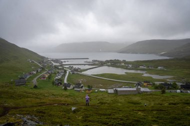 View over Skarsvag, Norway from top of hill clipart