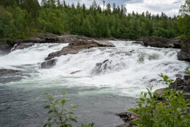 Malselvfossen waterfall in Norway in summer clipart