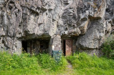 Narvik, Norway - 07.05.2024: Entrance of World War II bunker in rock in Narvik, Norway clipart