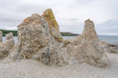 Trollholmsund dolomite rock formations next to Porsangerfjord in Norway clipart