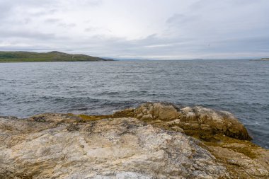 Landscape of Norwegian nature at Trollholmsund dolomite rock formations next to Porsangerfjord in Norway clipart