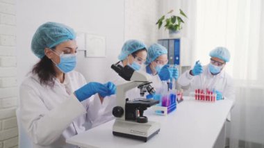 Medical Development Laboratory: portrait of a beautiful african american woman, Microscope, People do Medicine, Biotechnology Research in Advanced Lab