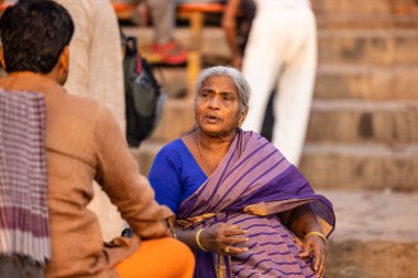 Varanasi, Uttar Pradesh, India - November 2022: Portrait of Unidentified Indian people near river ganges in varanasi city.