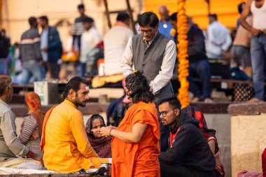 Varanasi, Uttar Pradesh, India - November 2022: Portrait of Unidentified Indian people near river ganges in varanasi city.