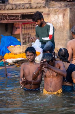 Varanasi, Uttar Pradesh, India - November 2022: Portrait of Unidentified Indian people near river ganges in varanasi city.