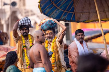 Varanasi, Uttar Pradesh, India - November 2022: Portrait of Unidentified Indian people near river ganges in varanasi city.