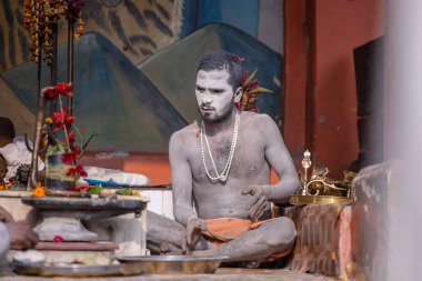 Varanasi, Uttar Pradesh, India - November 2022: Portrait of Unidentified Indian people near river ganges in varanasi city.