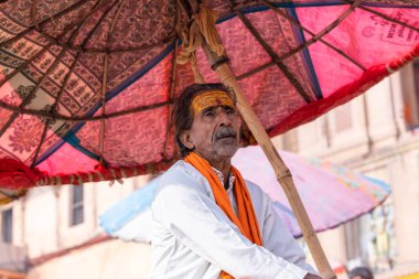 Varanasi, Uttar Pradesh, India - November 2022: Portrait of Unidentified Indian people near river ganges in varanasi city.