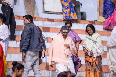 Varanasi, Uttar Pradesh, India - November 2022: Portrait of Unidentified Indian people near river ganges in varanasi city.