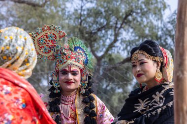 Bikaner, Rajasthan, India - January 2023: Camel Festival Bikaner, Group of young beautiful women in traditional dress and jewellery of rajasthan while participating in the parade. Selective focus.