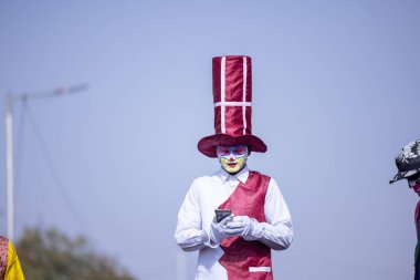 Bikaner, Rajasthan, India - January 2023: Camel festival, Portrait of an male artist with painted face and fantasy look while participating in camel festival parade at bikaner. Selective focus.